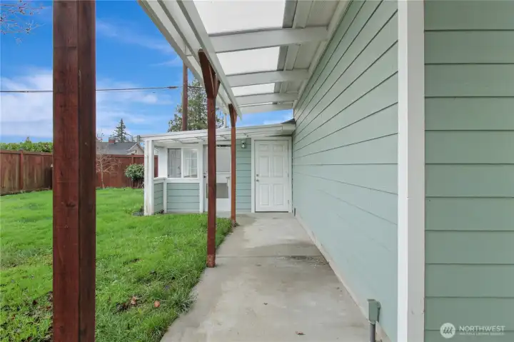 Covered breezeway to yard storage shed and greenhouse