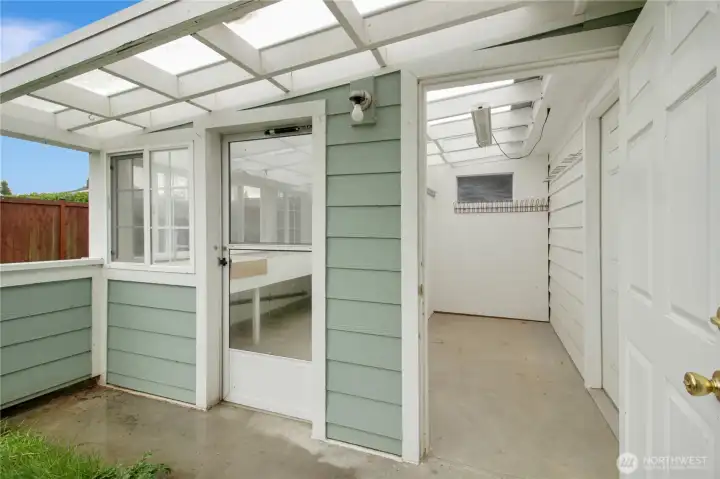 Shed for yard equipment between greenhouse and garage/attached.