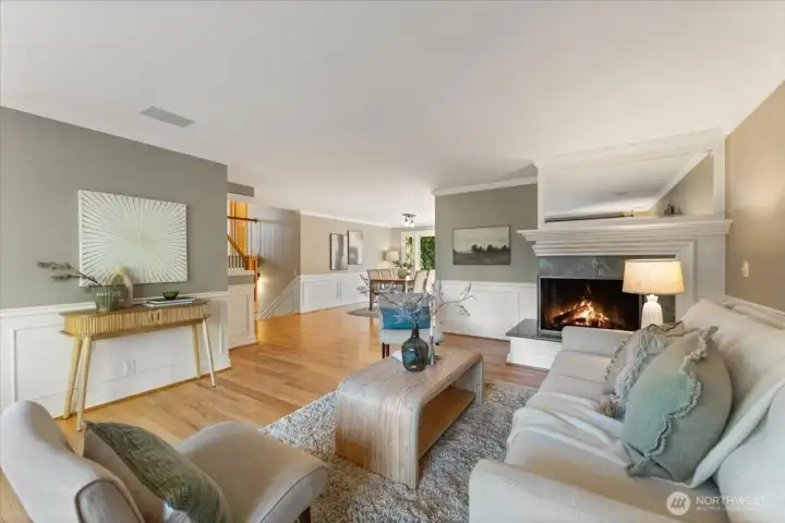 Gleaming hardwood floors on the main and upper levels, with panel detailing on the main floor that enhances the home’s clean, elevated aesthetic.