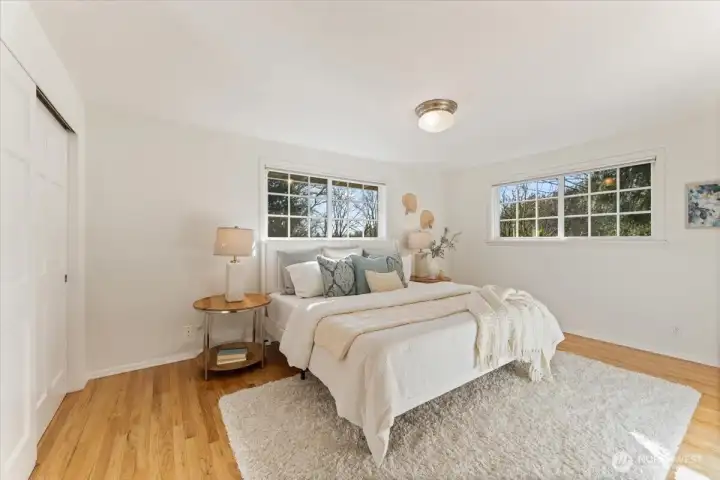 Upstairs find the light and airy primary bedroom and bathroom.