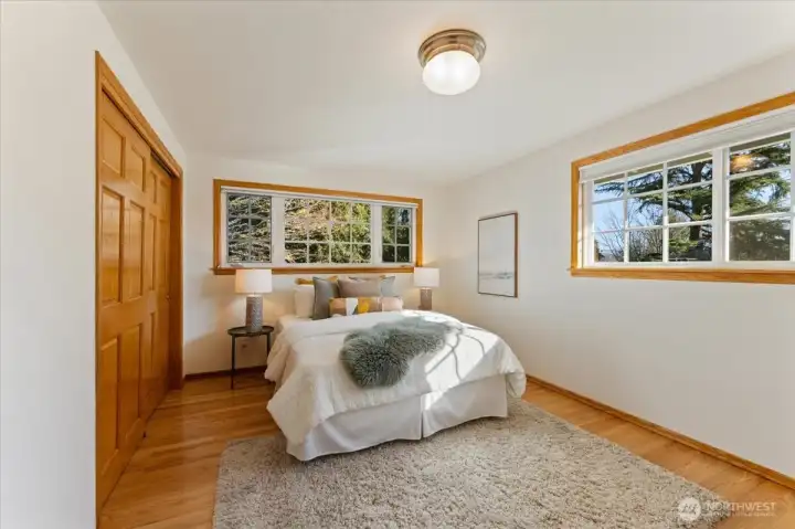 All three bedrooms enjoy abundant natural light, yet none look directly into neighboring homes, with mature trees providing both privacy and soft shade.