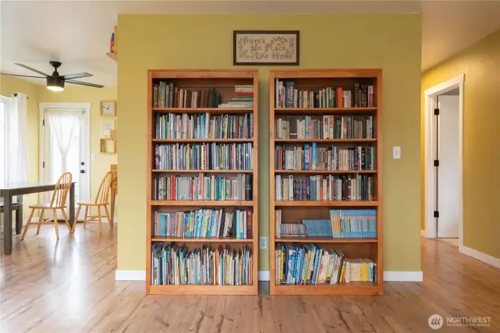 Eating area off of the kitchen is on the left and the open door to the right leads to bedroom #1 or an office.
