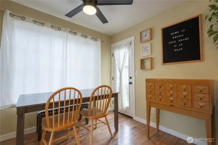 Eating area with an exterior door leading to backyard.
