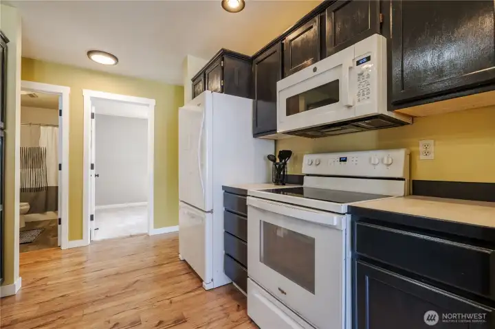 The open door leads to a bedroom or office.