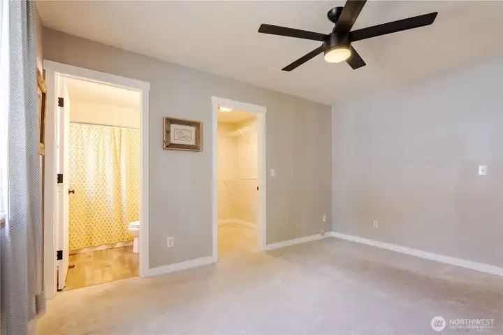 Primary bedroom with bathroom and walk-in closet.
