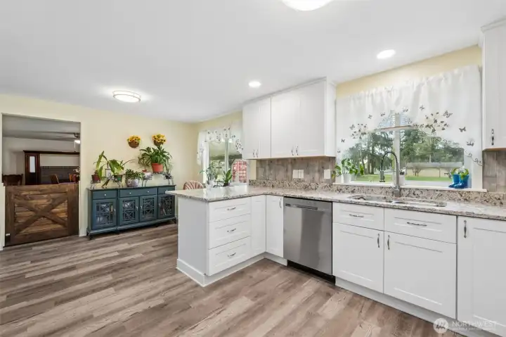 Remodeled kitchen with abundant natural light, modern finishes, and great flow.