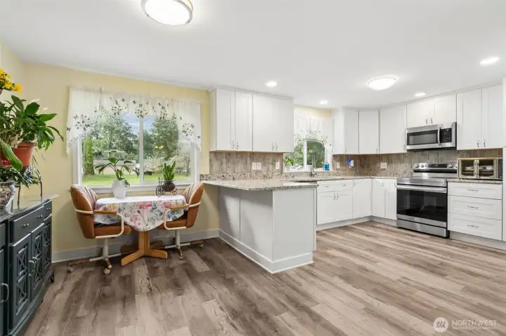 Open kitchen and dining area, eat at the kitchen counter area - bright, functional, and perfect for everyday living.