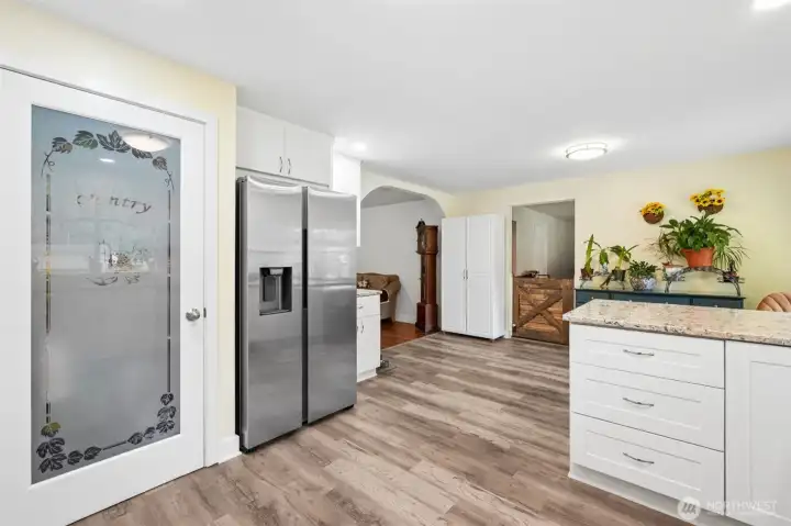 Functional kitchen layout with pantry, great storage and easy flow to living spaces, pantry on way to family room stays!