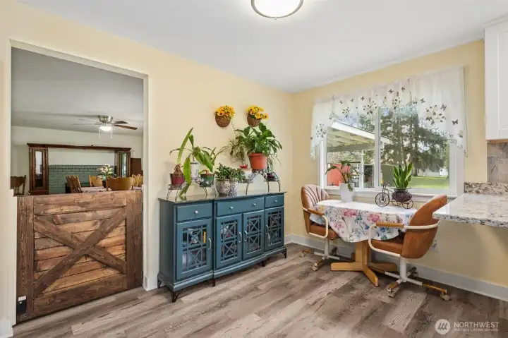 Bright kitchen dining nook with backyard views and leading to family room with wood burning fireplace! Perfect for every day living.