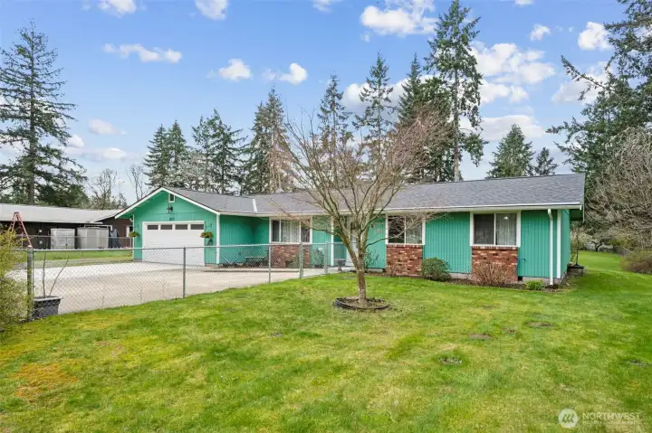 Front yard with gated access to fenced garden area - great for pets, garden beds, raised or in-ground!