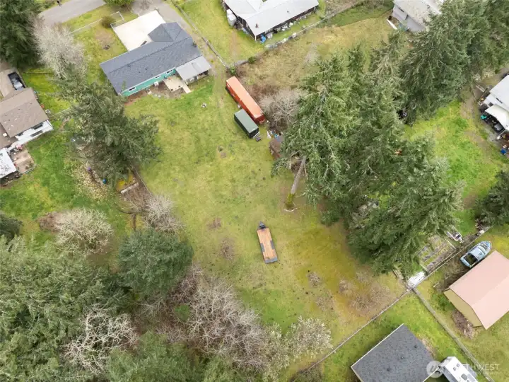 Large lot surrounded by mature trees - space and potential, all in one.