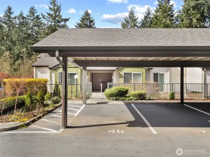 Unit parking spot #48 at end of carport with extra space on one side for easier loading and unloading.
