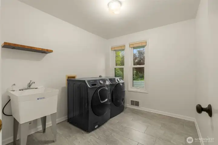 One of two laundry rooms. Lower level.