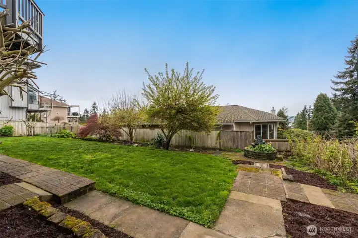 Mature landscape. Sun-drenched property, w/lush landscape, gazebo, stone pathways & fruit trees. Room to work, garden and play!