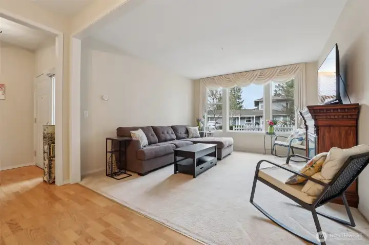 Living room is just off the entry and welcomes you home