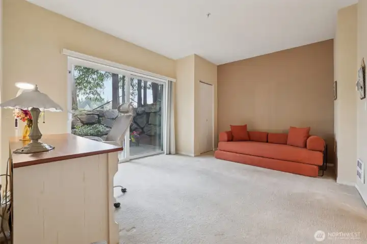 2nd Bedroom is quite large with access to the side patio