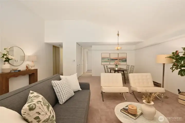 Looking into the formal dining room, connects to the kitchen and a wet bar accompanies the vibe to the left.