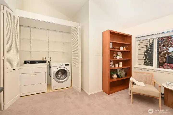 Full-size laundry with additional storage.