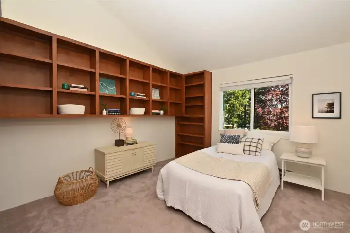 Second bedroom with beautiful bookcases and tons of closet space.
