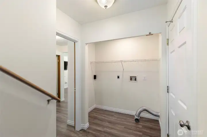 View of the area for the washer and dryer located off of the garage.
