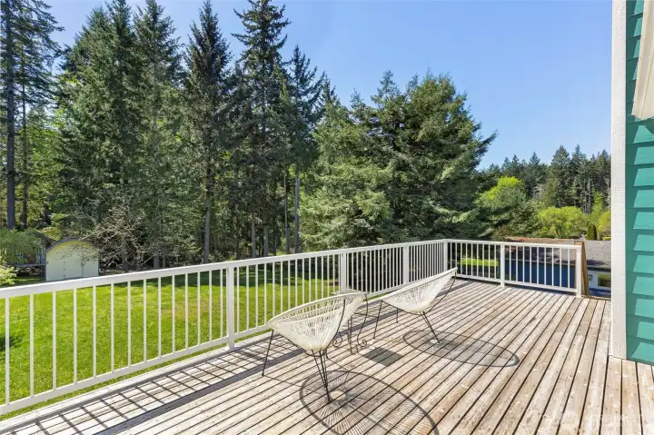 This large upstairs deck overlooks the beautiful yard filled with colorful perennials, vegetable gardens and a playhouse. The deck is plumbed for your propane barbeque