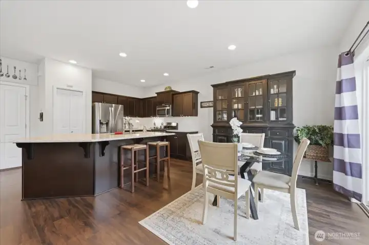 Island for casual eating, plus dining space