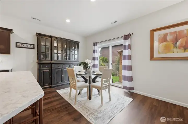 Dining area opens to extended patio