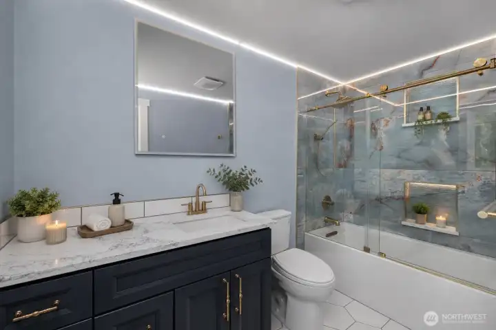 Photo digitally staged. Primary bath.