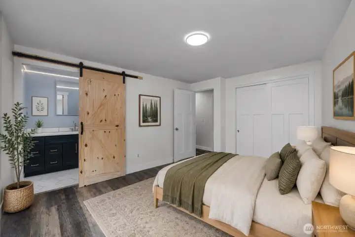 Photo digitally staged. Primary bedroom.