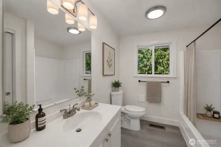 Photo digitally staged. 2nd bathroom.