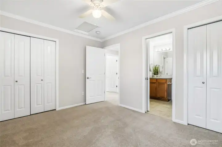 Upper level bedroom with adjoining full bathroom.