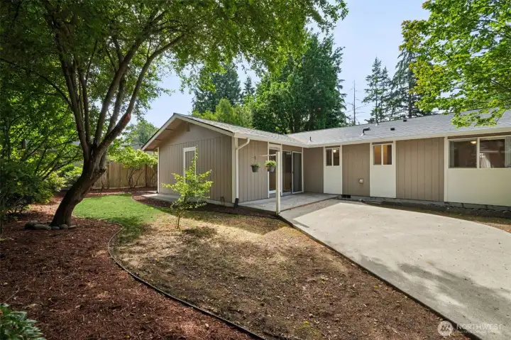 The fully fenced backyard offers ample space for entertaining, gardening, or relaxing.