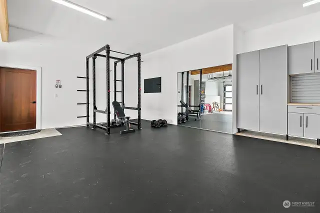 Huge 3 car garage comes equipped with gym and built in cabinets!