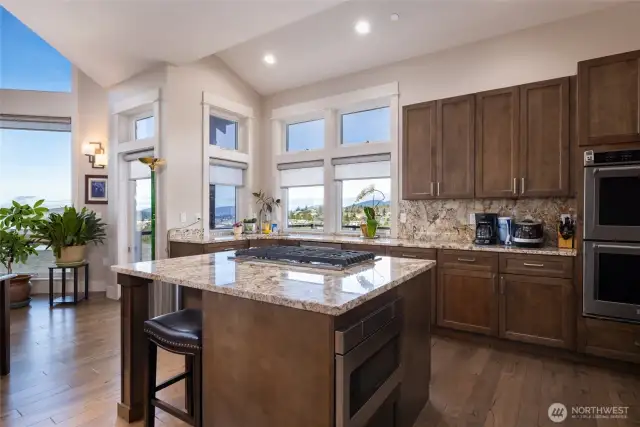 Door to the left of the kitchen provides access out to the deck.