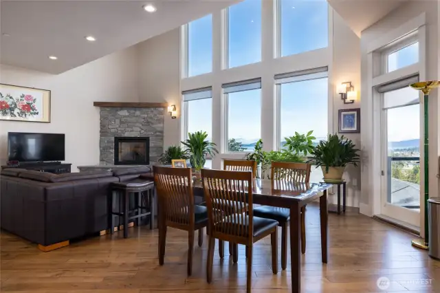 Gas fireplace with stone surround for cozy winter nights. Artfully arranges to not block the view.