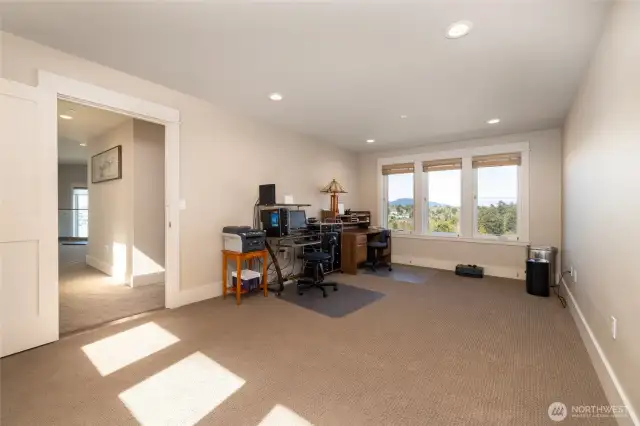 Large room over garage is currently used as an office, but could be converted to a bedroom if a closet is added. Could also be used for an exercise room.