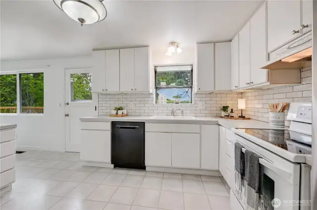 Nice size kitchen!  Door leads to Large entertaining deck! Ready to update to your liking, or very liveable as is!