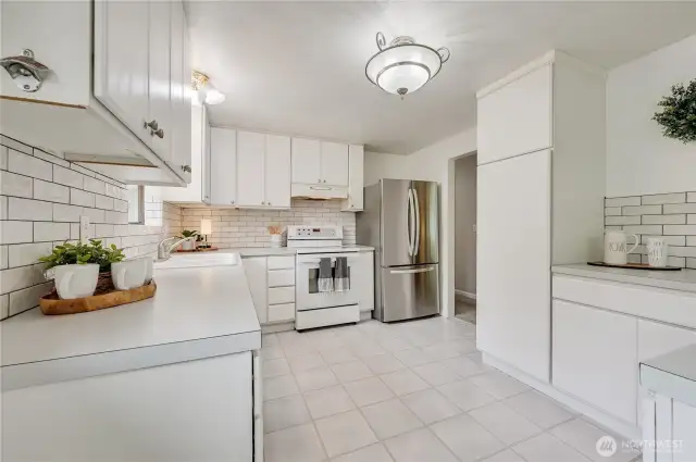 Lots of counter space and many cabinets to include pantry cabinet with pull outs
