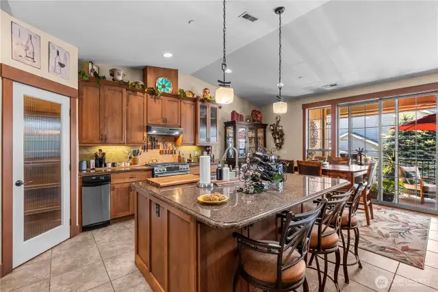Gorgeous chefs kitchen w/ stainless appliances, granite counters & walk-in pantry