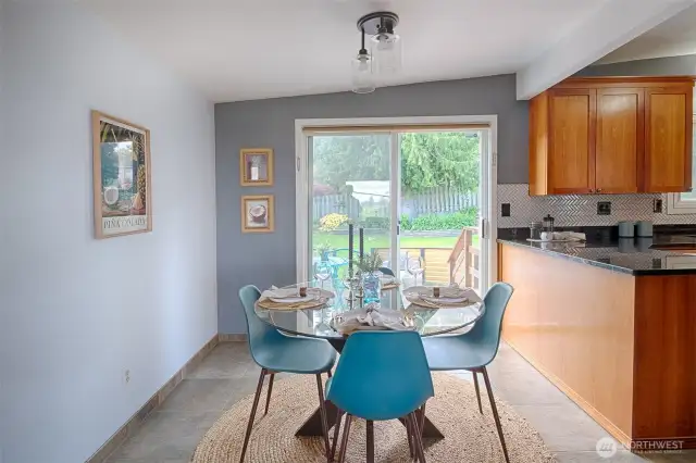 Dining room opens to living room and also out to Trex deck and backyard patio.