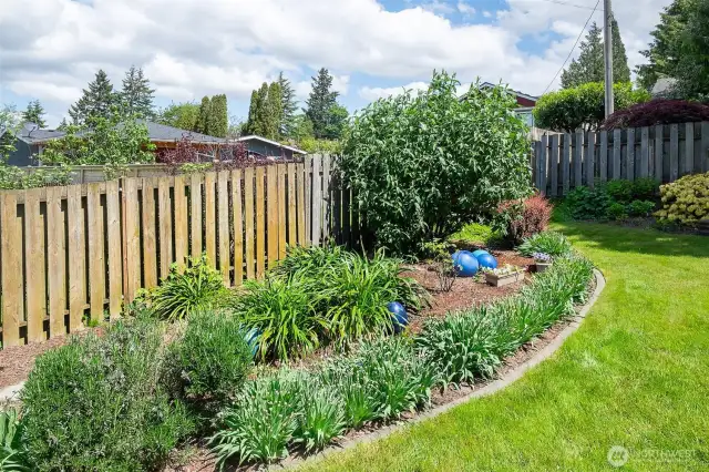 Mature landscaping and tons of flower plantings that bloom throughout the warmer months.