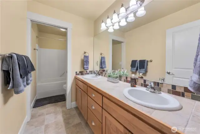 Full bath upstairs with pocket door separate toilet/shower