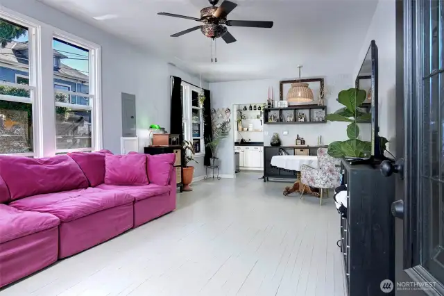Large living and dining room with updated windows and an abundance of light