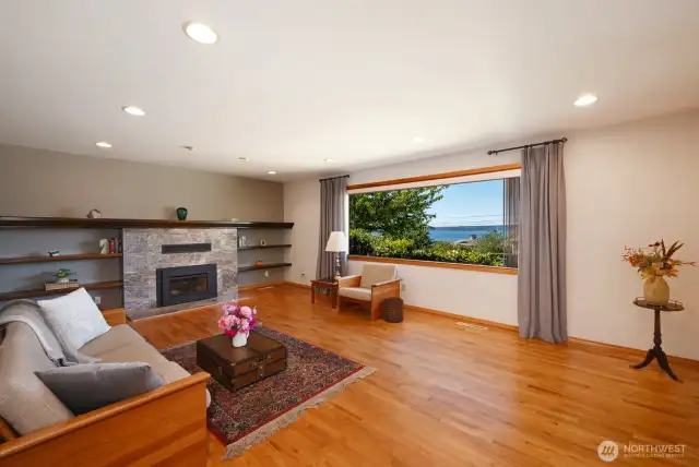 The large picture window welcomes in the natural light and peaceful sound view.