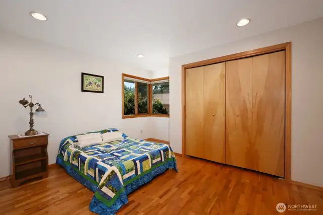 Primary bedroom with large closet and some built-ins.