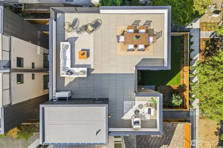 Huge Rooftop deck provides expansive outdoor entertaining space with views of Puget Sound and Olympic Mountains