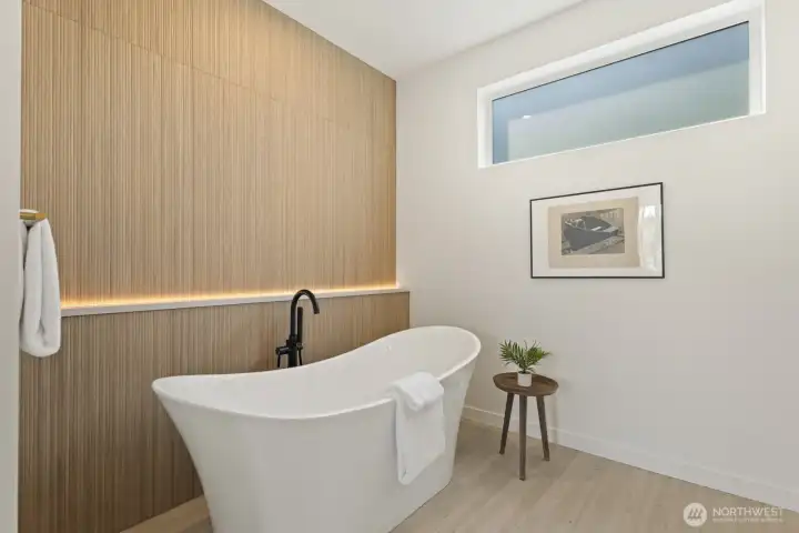 Soaking tub with custom lighting and tub filler