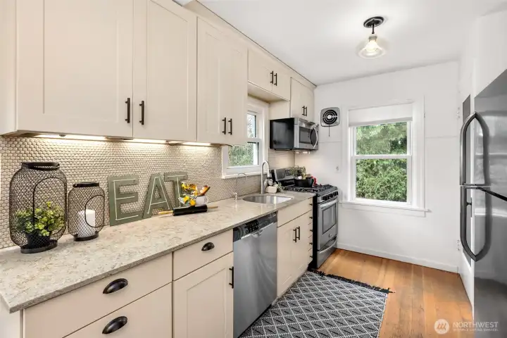 Updated kitchen with stainless steel appliances.