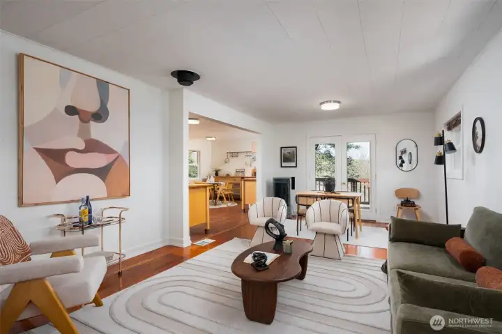 You enter into your living room and main living space. An additional side northern view deck is there for more outside time.