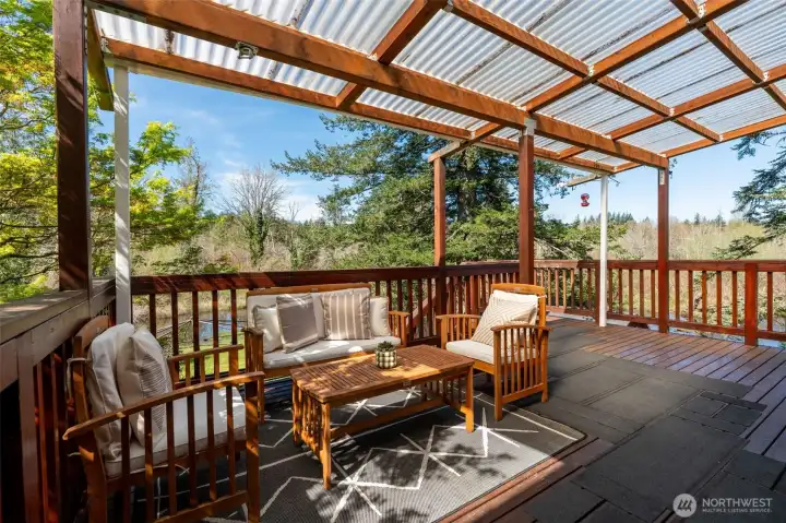 Back deck off of kitchen to enjoy those evening sunsets or fresh air anytime of day with the cover to keep your dry!
